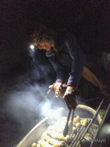 Jen cooks kebabs over the campfire at San Angelo State Park, San Angelo, Texas