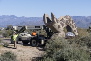 Jake Lambert of Premier Construction drives the second half of the rattlesnake's to the playground.