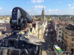 Jen and Guy shoot video from the top of Carfax Tower in Oxford, England